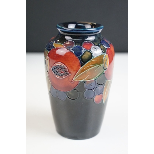 65 - Moorcroft small pomegranate vase, signed to base, H 11cm together with a Moorcroft rectangular pot l... 