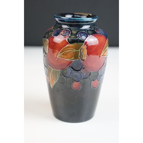 65 - Moorcroft small pomegranate vase, signed to base, H 11cm together with a Moorcroft rectangular pot l... 