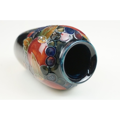 65 - Moorcroft small pomegranate vase, signed to base, H 11cm together with a Moorcroft rectangular pot l... 