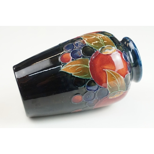 65 - Moorcroft small pomegranate vase, signed to base, H 11cm together with a Moorcroft rectangular pot l... 