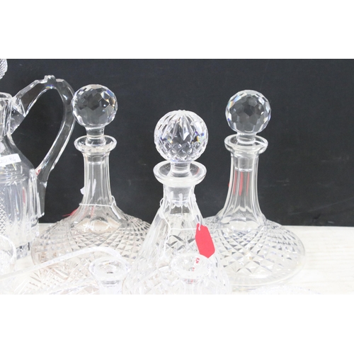 72 - Collection of cut glass to include decanters, ship's decanters, graduating dishes and bowls