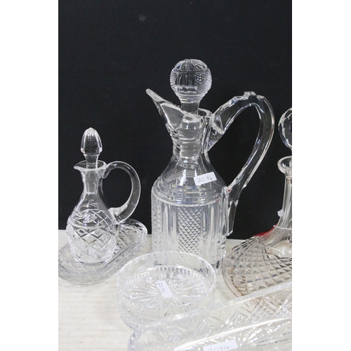 72 - Collection of cut glass to include decanters, ship's decanters, graduating dishes and bowls