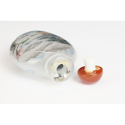 211 - Chinese tiger's eye feng shui ingot, 3.5cm high, a Chinese scent bottle and lid painted with a figur... 