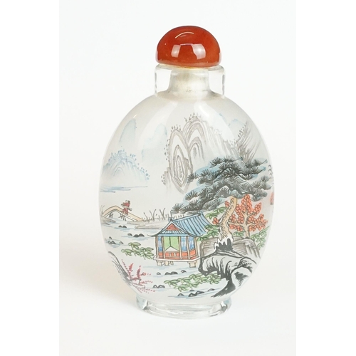 211 - Chinese tiger's eye feng shui ingot, 3.5cm high, a Chinese scent bottle and lid painted with a figur... 