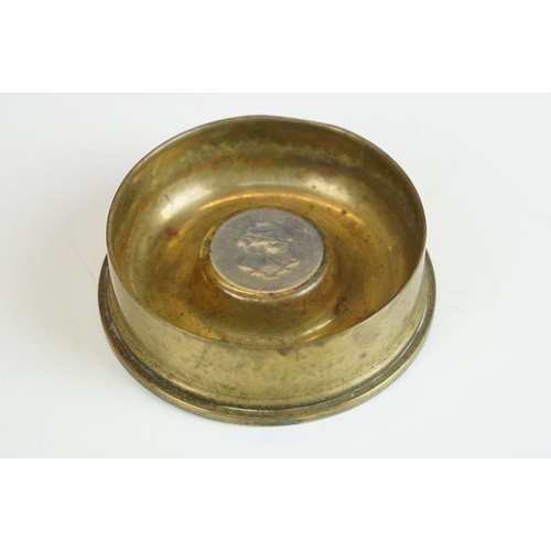 418A - Trench art artillery shell ashtrays dated 1915 together with a selection of military buttons, cap ba... 