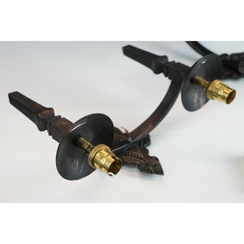 430 - Pair of gothic style, black with gold accents double wrought iron wall lights together two wrought i... 