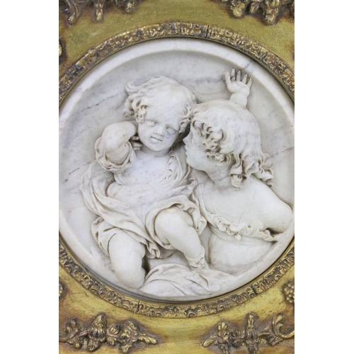 100 - After Edward William Wyon framed marble relief of children cherubs within gilt frame, the reverse in... 