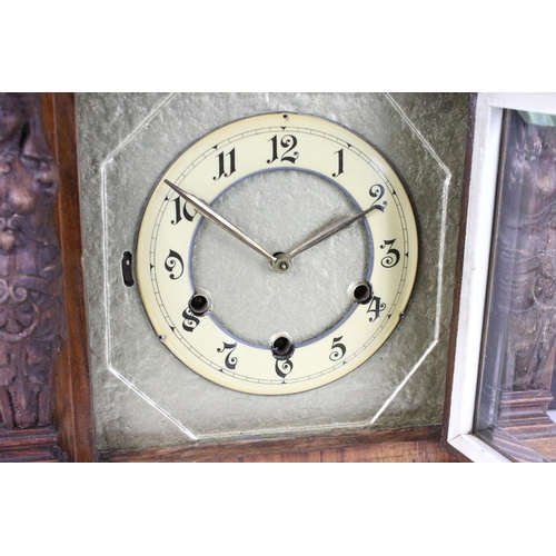 102 - Early 20th century cased architectural mantel clock with two carved maiden figureheads, glass sides,... 