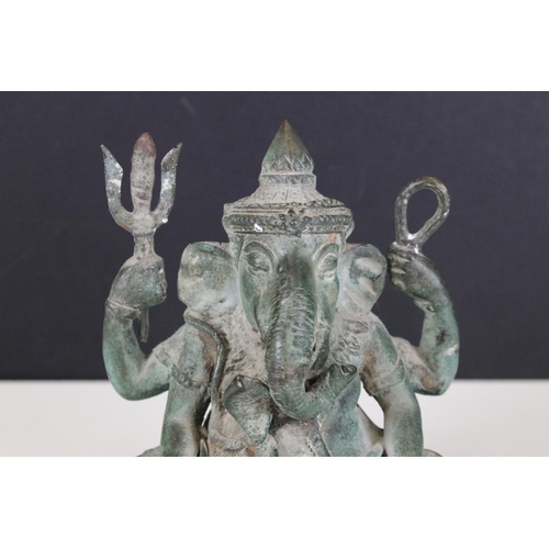 104 - Ganesh four armed seated god statue, H 15cm