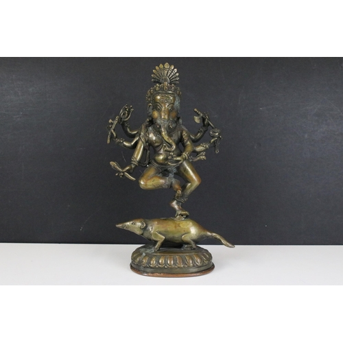 120 - Brass dancing standing Ganesha god temple statue with six arms on mouse, H 29cm