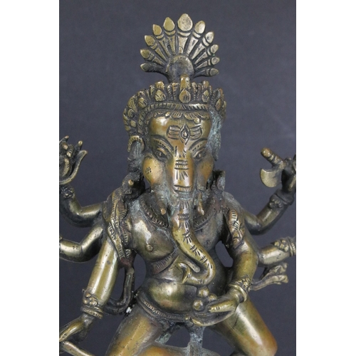 120 - Brass dancing standing Ganesha god temple statue with six arms on mouse, H 29cm