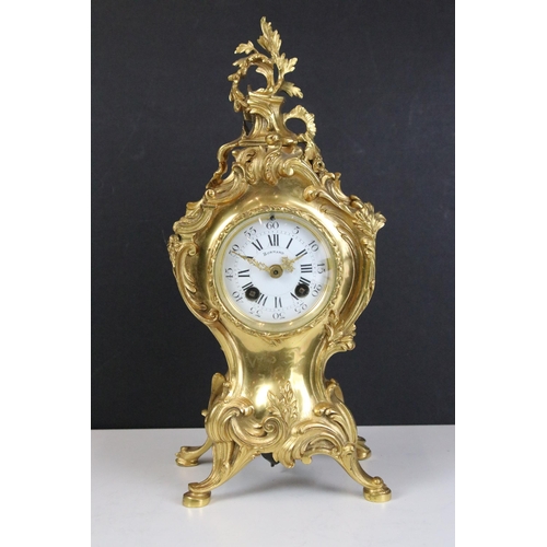 133 - French gilt metal Bornand Rococo mantel clock, H 30cm, with pair of matching two branched candle hol... 