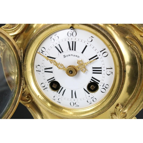 133 - French gilt metal Bornand Rococo mantel clock, H 30cm, with pair of matching two branched candle hol... 