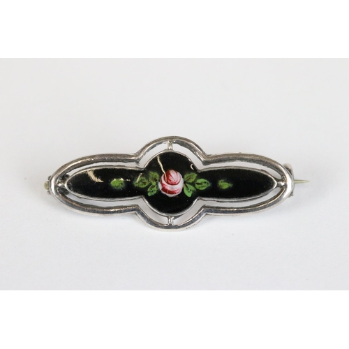 165 - Charles Horner sterling silver brooch set with a black enamel panel decorated with a flower