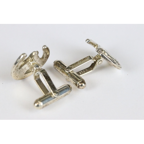 167 - Pair of silver equestrian cufflinks in the form of a horse head within a horse shoe, Birmingham hall... 