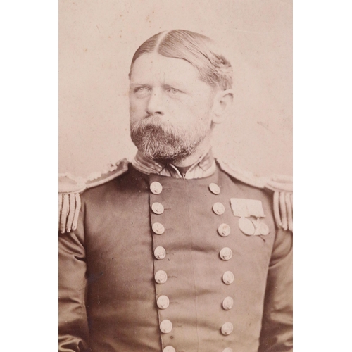 171 - A Victorian black and white photograph of a senior officer wearing medals together with another of a... 