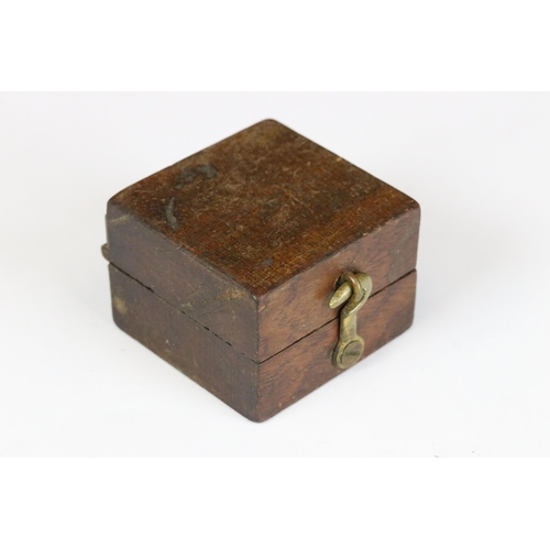 183 - An early to mid 20th century brass cased pocket compass set within a wooden box together with leathe... 