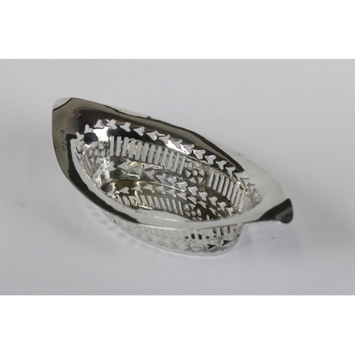 185 - A fully hallmarked sterling silver bonbon dish with pierced decoration together with a silver and bl... 