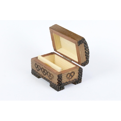 187 - A collection of three wooden trinket boxes of various sizes and forms. Largest measures approx 11cm ... 