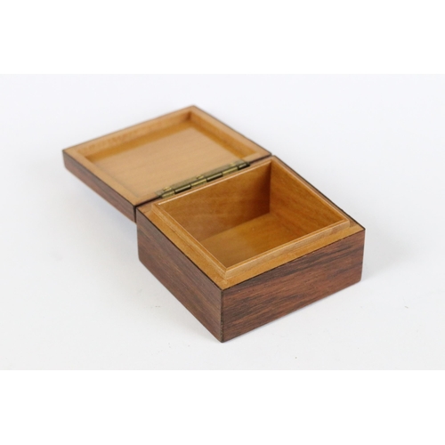 187 - A collection of three wooden trinket boxes of various sizes and forms. Largest measures approx 11cm ... 