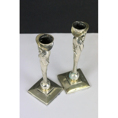 196 - Pair of unusual candlesticks in the form of Jewish figures stamped '800'