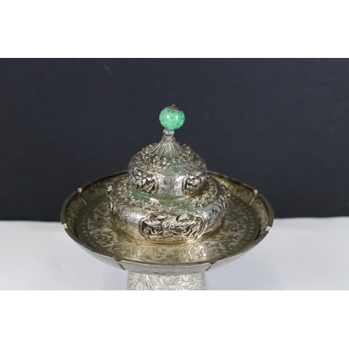 202 - A Chinese / Tibetan silver / white metal cup stand and lid with fine chased decoration, stands appro... 