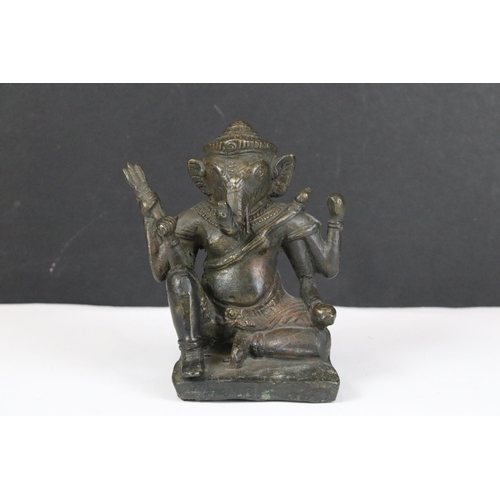 204 - A collection of three Indian cast metal Hindu elephant god Ganesha ornamental figures, largest stand... 