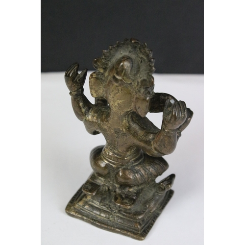 204 - A collection of three Indian cast metal Hindu elephant god Ganesha ornamental figures, largest stand... 