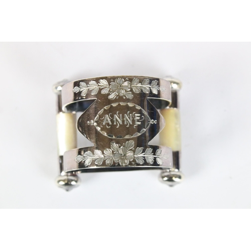 210 - A fully hallmarked sterling silver napkin ring with cylindrical mother of pearl to base, assay marke... 