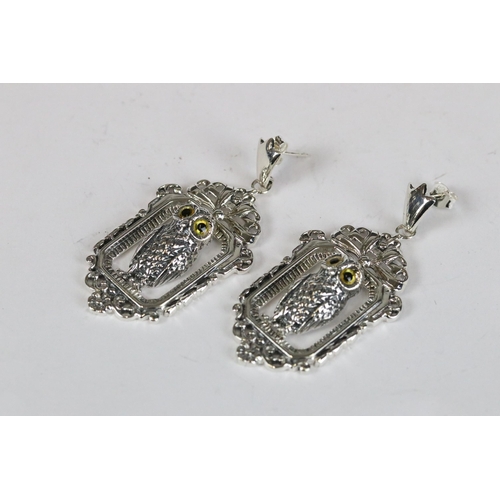 224 - Pair of silver and lucky owl drop earrings