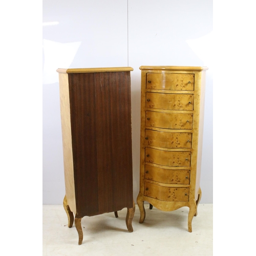 559 - Pair of serpentine fronted yew chests of drawers, each with seven drawers, raised on cabriolet legs ... 