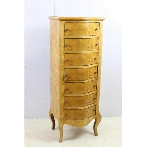 559 - Pair of serpentine fronted yew chests of drawers, each with seven drawers, raised on cabriolet legs ... 