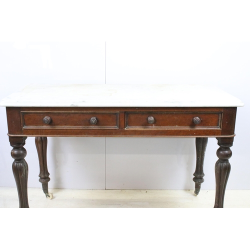 595 - Mahogany and marble washstand server table with two drawers, raised on reeded fluted legs and castor... 