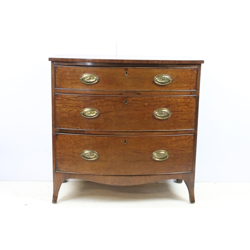 604 - Mahogany bow front chest of drawers with three long drawers and bird motif handles on raised legs, H... 