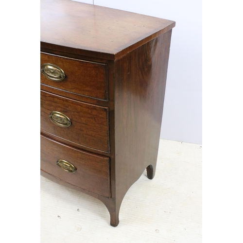 604 - Mahogany bow front chest of drawers with three long drawers and bird motif handles on raised legs, H... 