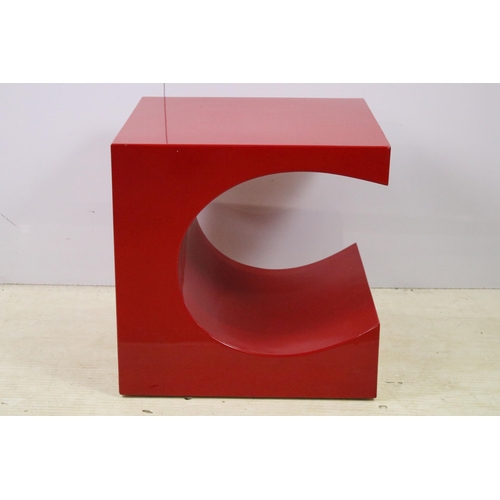 616 - Red painted steel coffee table in abstract design, H 50cm, W 50cm, D 50cm