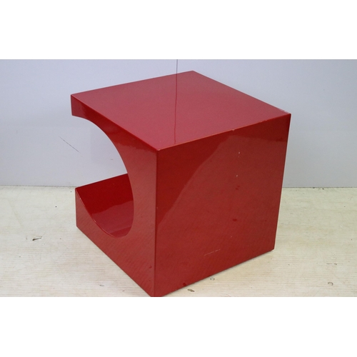 616 - Red painted steel coffee table in abstract design, H 50cm, W 50cm, D 50cm