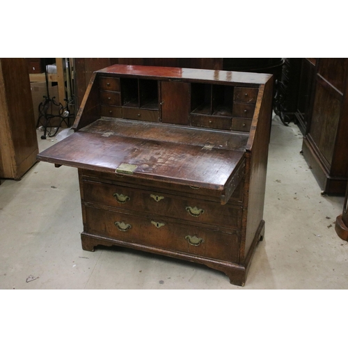 617 - Antique walnut writing bureau with fold down opening revealing eight drawers, four pigeon holes and ... 