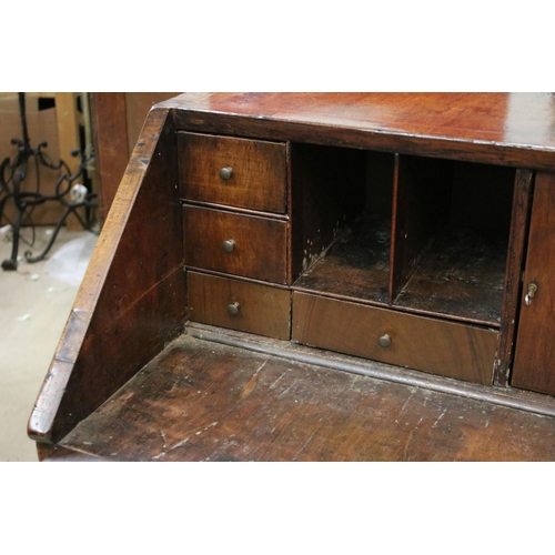 617 - Antique walnut writing bureau with fold down opening revealing eight drawers, four pigeon holes and ... 