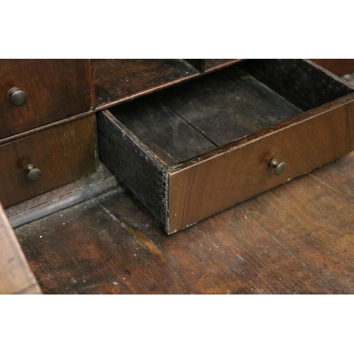 617 - Antique walnut writing bureau with fold down opening revealing eight drawers, four pigeon holes and ... 