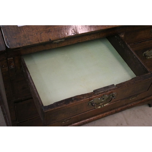 617 - Antique walnut writing bureau with fold down opening revealing eight drawers, four pigeon holes and ... 