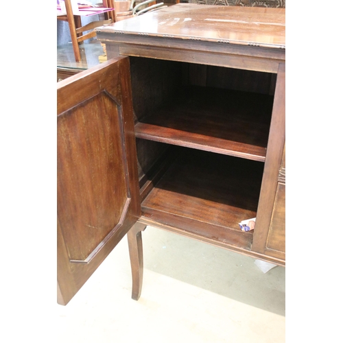 624 - Large mahogany side board with carved detail edges on raised square legs with two cupboards and two ... 