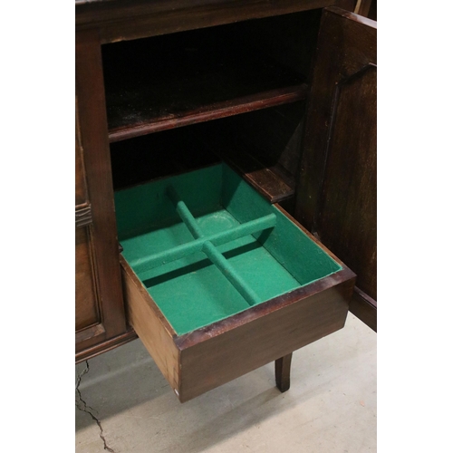 624 - Large mahogany side board with carved detail edges on raised square legs with two cupboards and two ... 