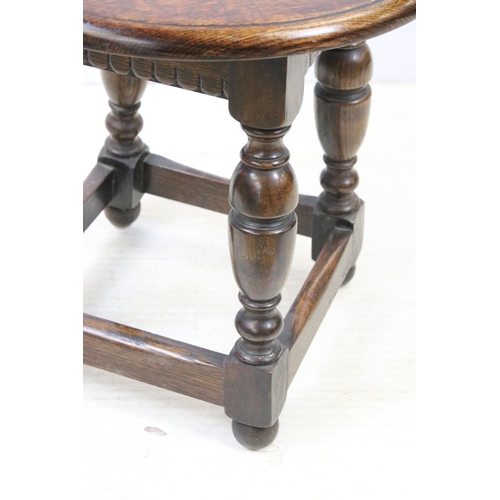 626 - Small oak side table with turned legs and plain stretchers, H 46cm, diameter 46cm