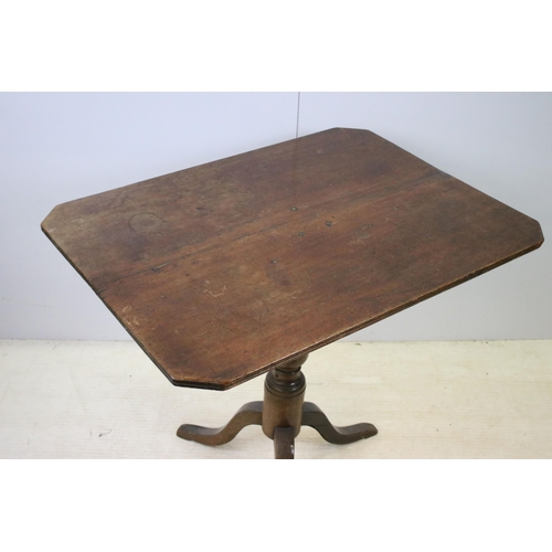 627 - Small mahogany fixed top table on tripod legs, H 73cm, W 83cm, D 62cm