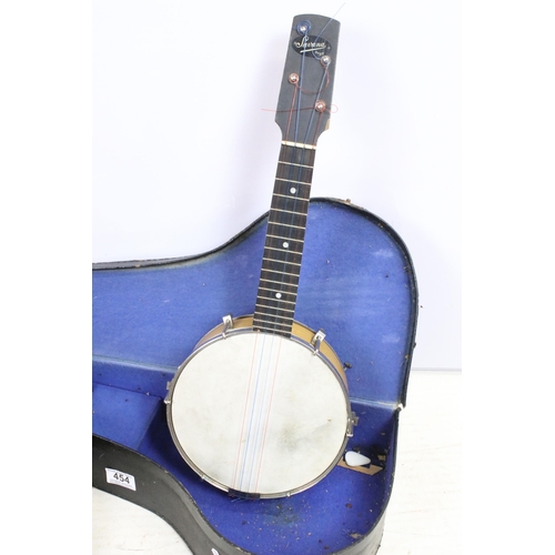 454 - Savana Ukulele banjo with four strings and decorative white metal etched back panel, in case, togeth... 