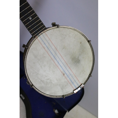 454 - Savana Ukulele banjo with four strings and decorative white metal etched back panel, in case, togeth... 