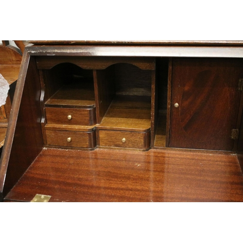 639 - 20th century mahogany four drawered veneered writing bureau bookcase with glazed front and pull down... 