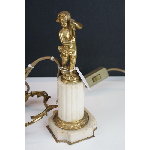 441 - Pair of 20th century gilt metal two arm cherub style table lamps with marble column bases, H 39cm