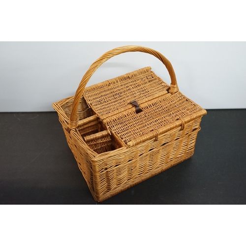 444 - Wicker picnic basket with bottle carrying compartments and fastening lidded compartment containing p... 